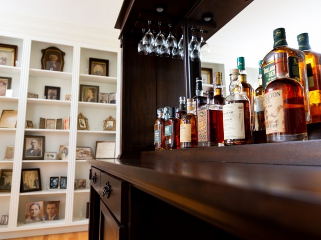 whiskey bottles on the bar