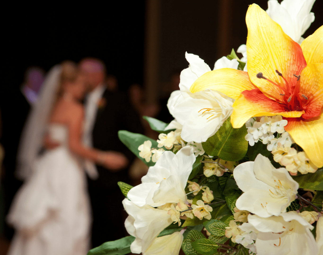 A portait image of a bouquet and wedding couple